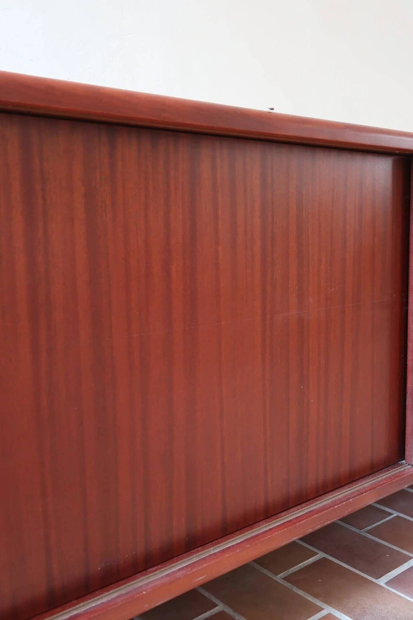 Teak enfilade, sliding doors, black faux leather top, 1970s.