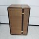 Wardrobe trunk on casters in mahogany and woven rattan.