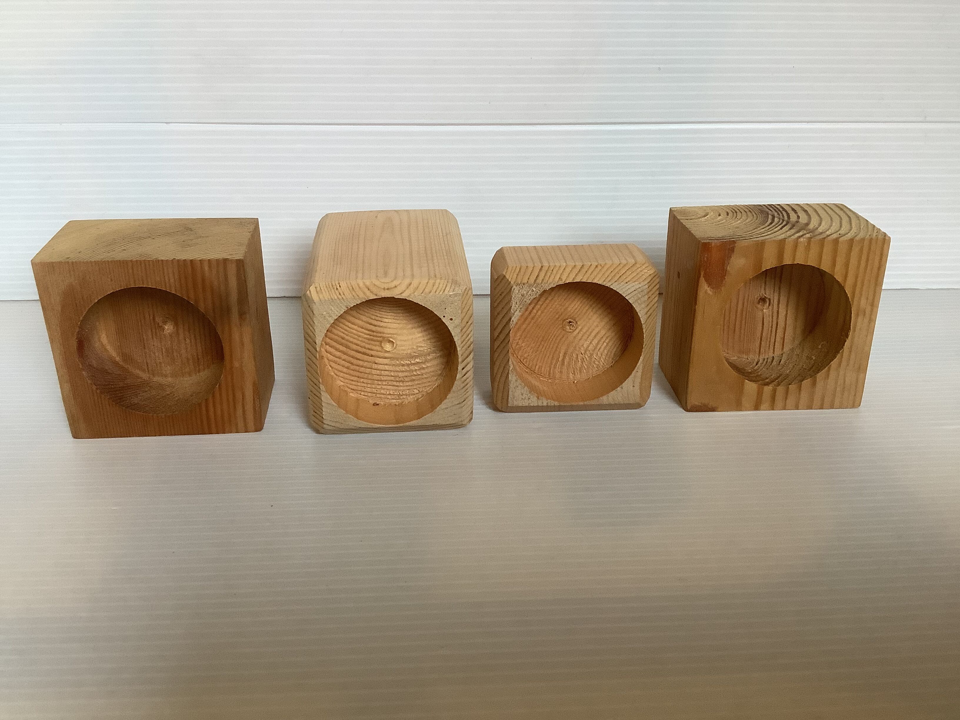 Set of four scandinavian wooden candle holders