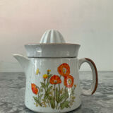 Vintage stoneware jug and its citrus juicer.