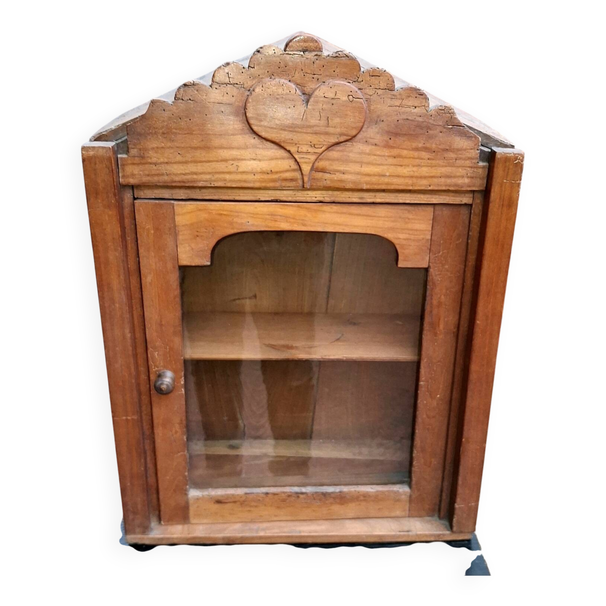 Showcase of popular art in solid wood, carved heart.