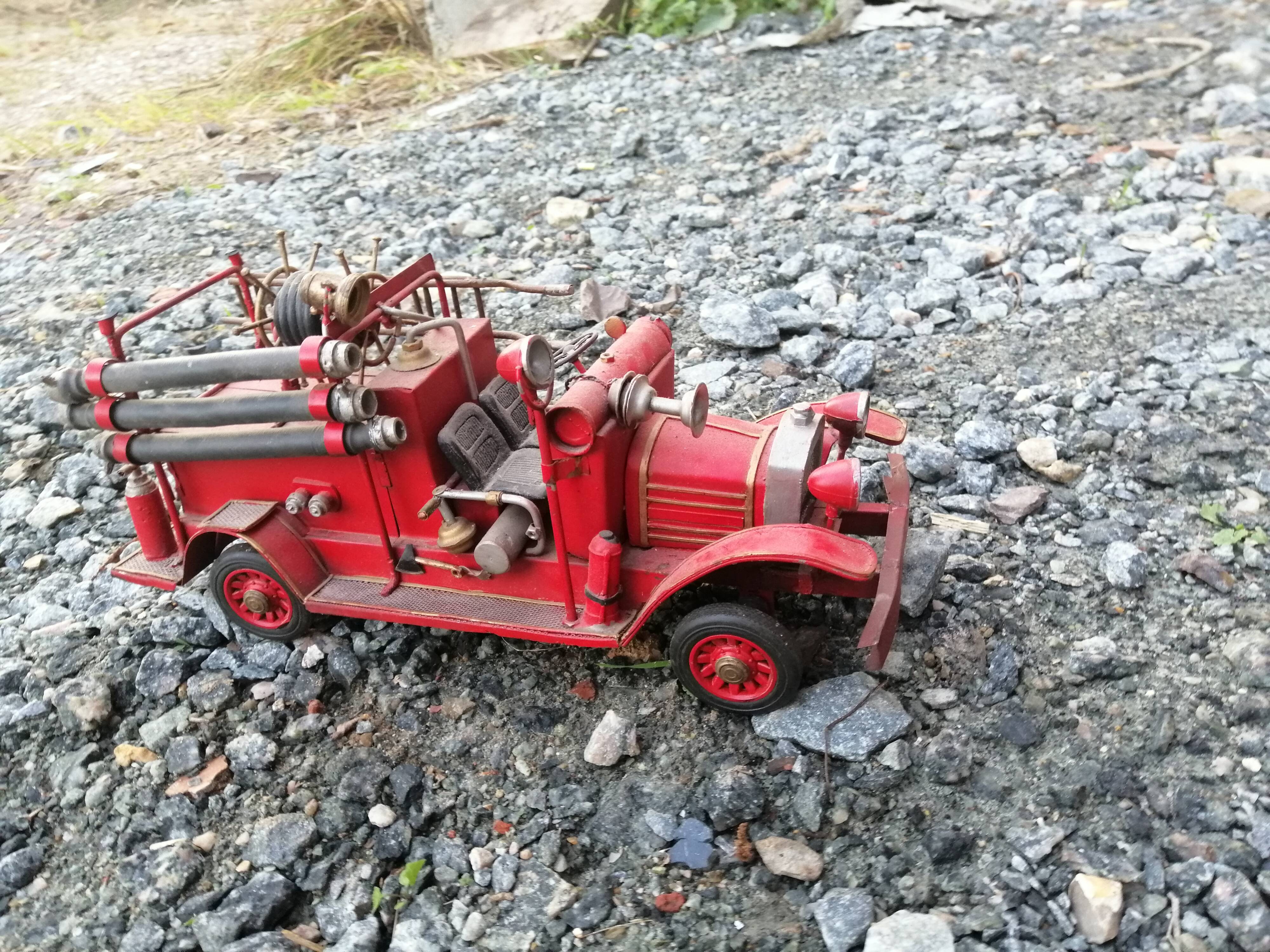 American fire truck from 1930 in sheet steel with all its water lance accessories,