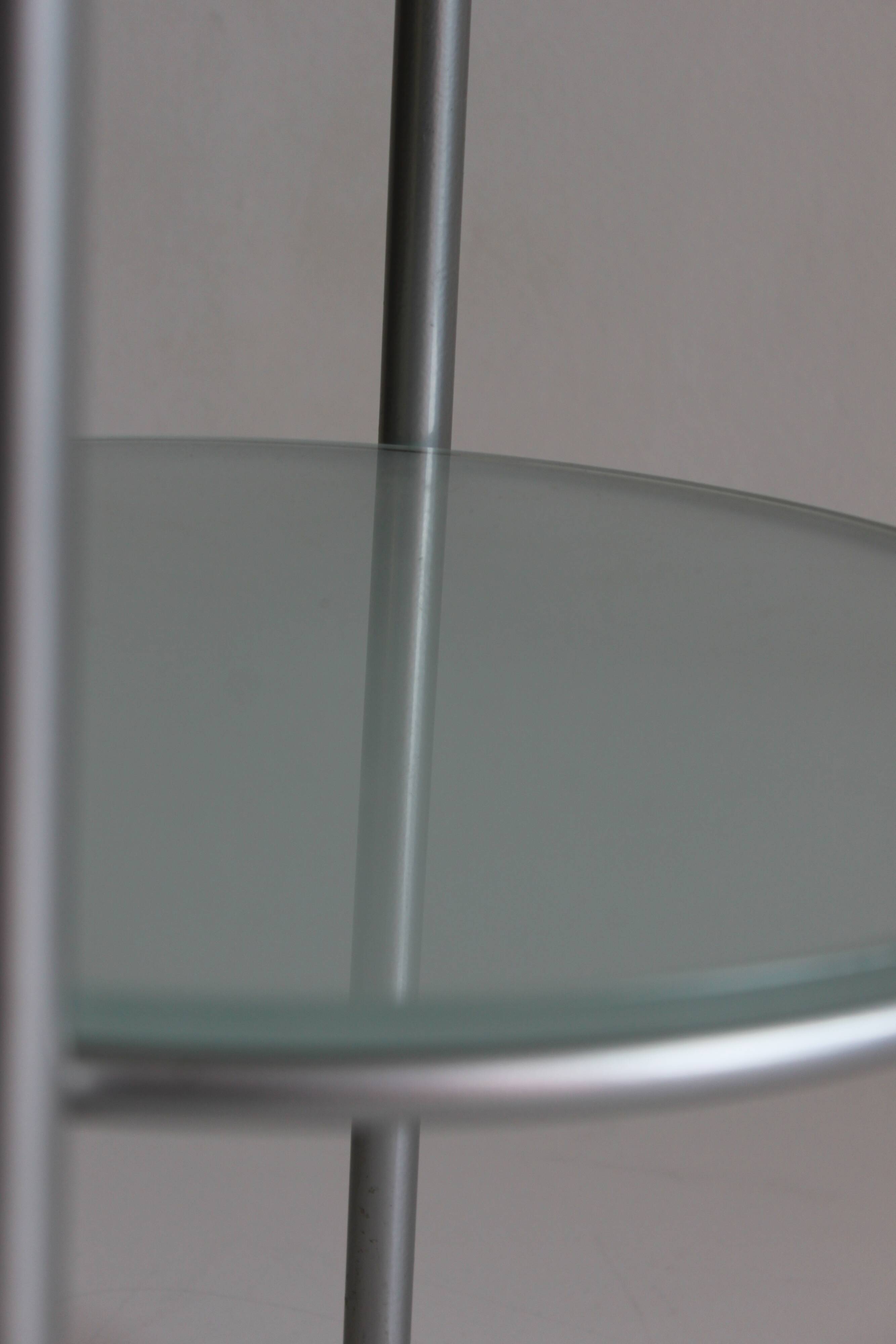 Postmodern round glass  and steel side table, 1980s.