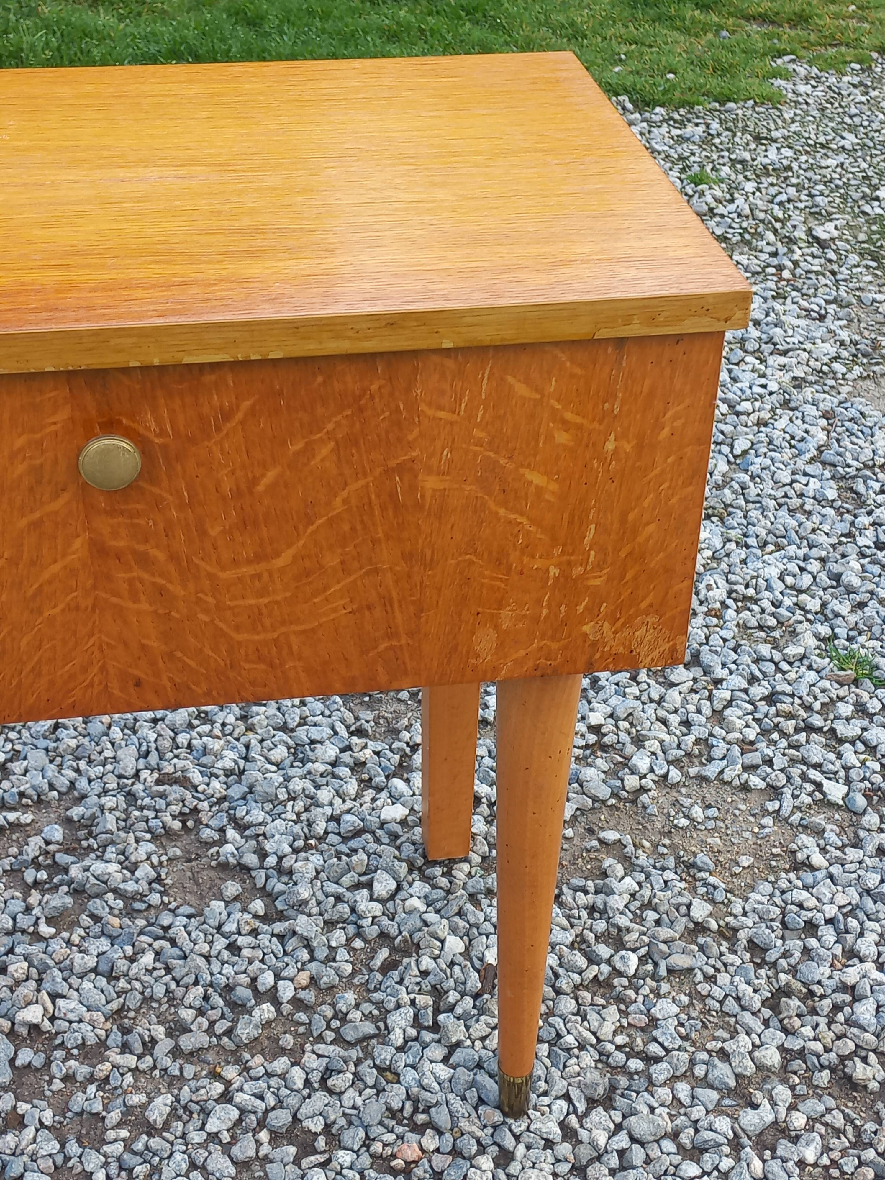 Vintage 1950s bedside table in blond oak with conical legs