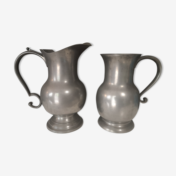Pair of tin pitchers
