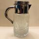 Refrigerant pitcher made of crystal and silver metal
