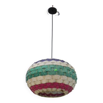 Handmade suspension in coloured woven natural plant fibres.