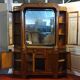 Empire style half-moon shaped mahogany bookcase with putti