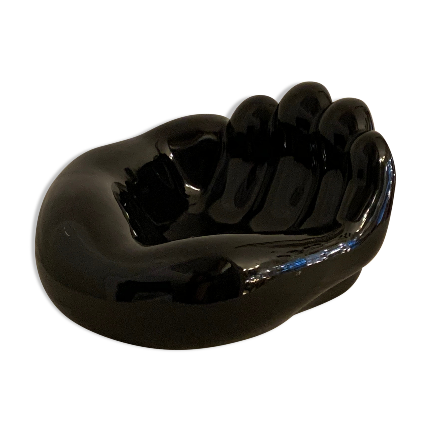 Black ceramic ashtray left hand