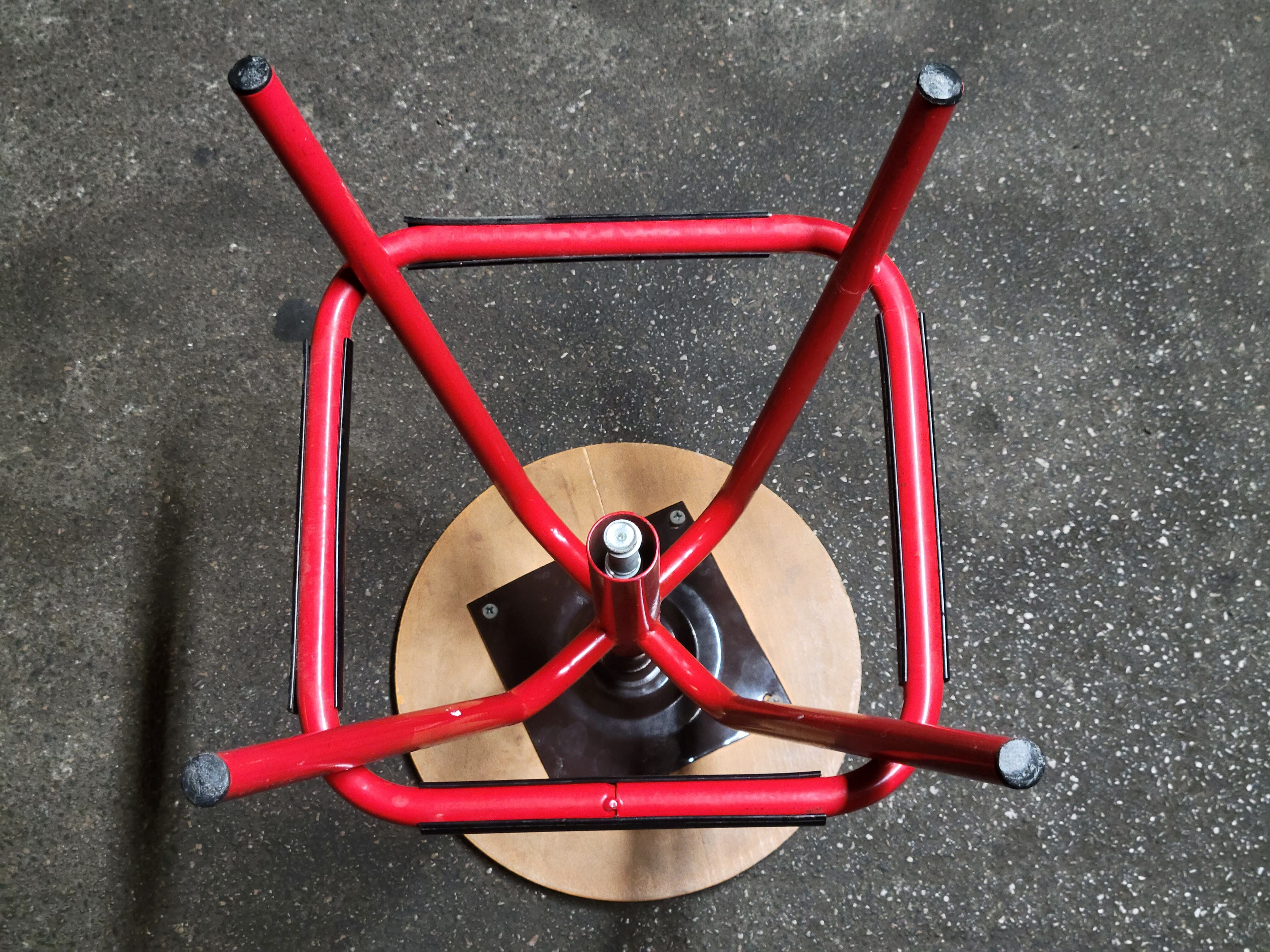 Red stool with industrial vintage screw 80s