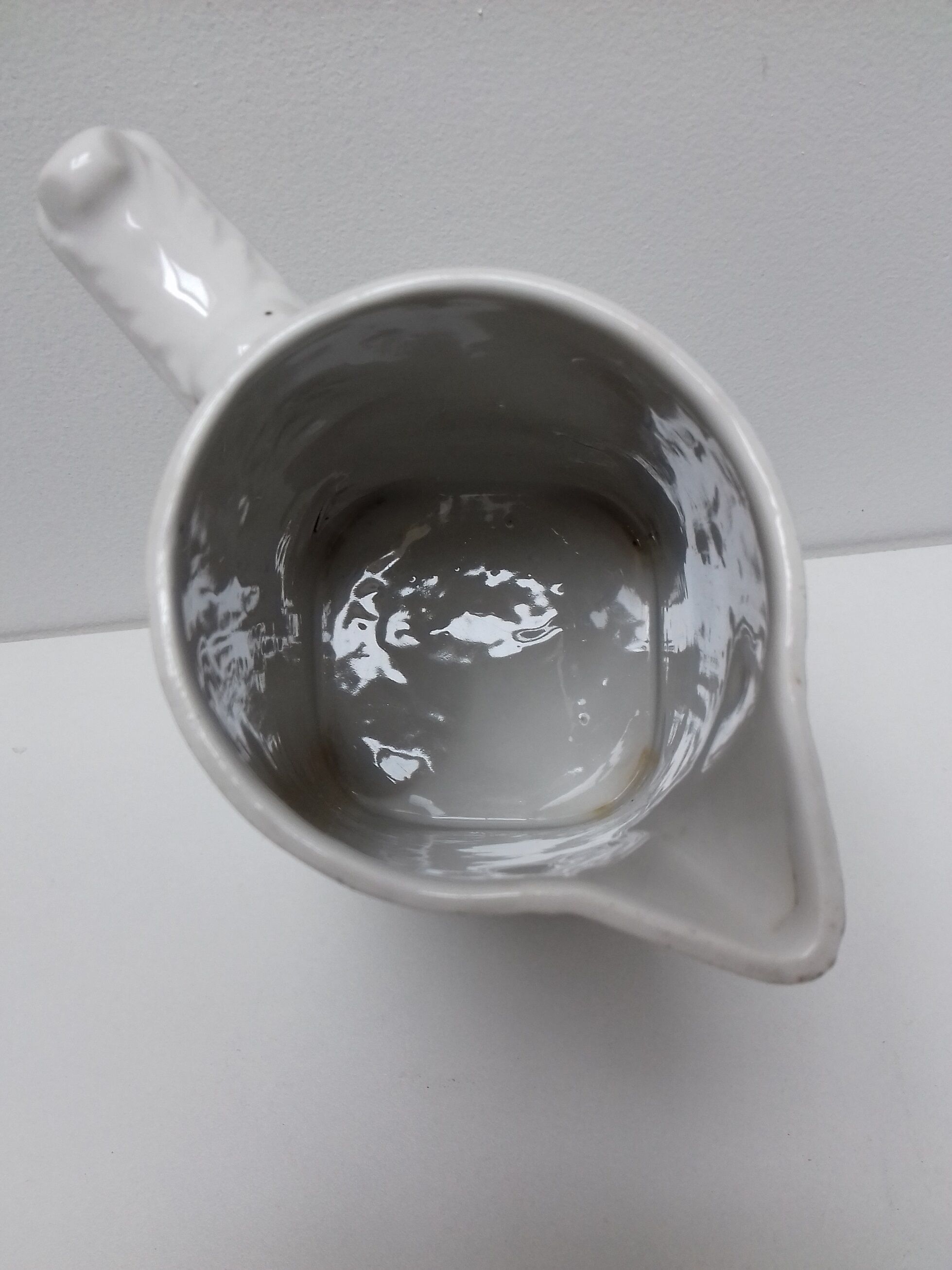 Ancient pitcher ceramic blue flowers