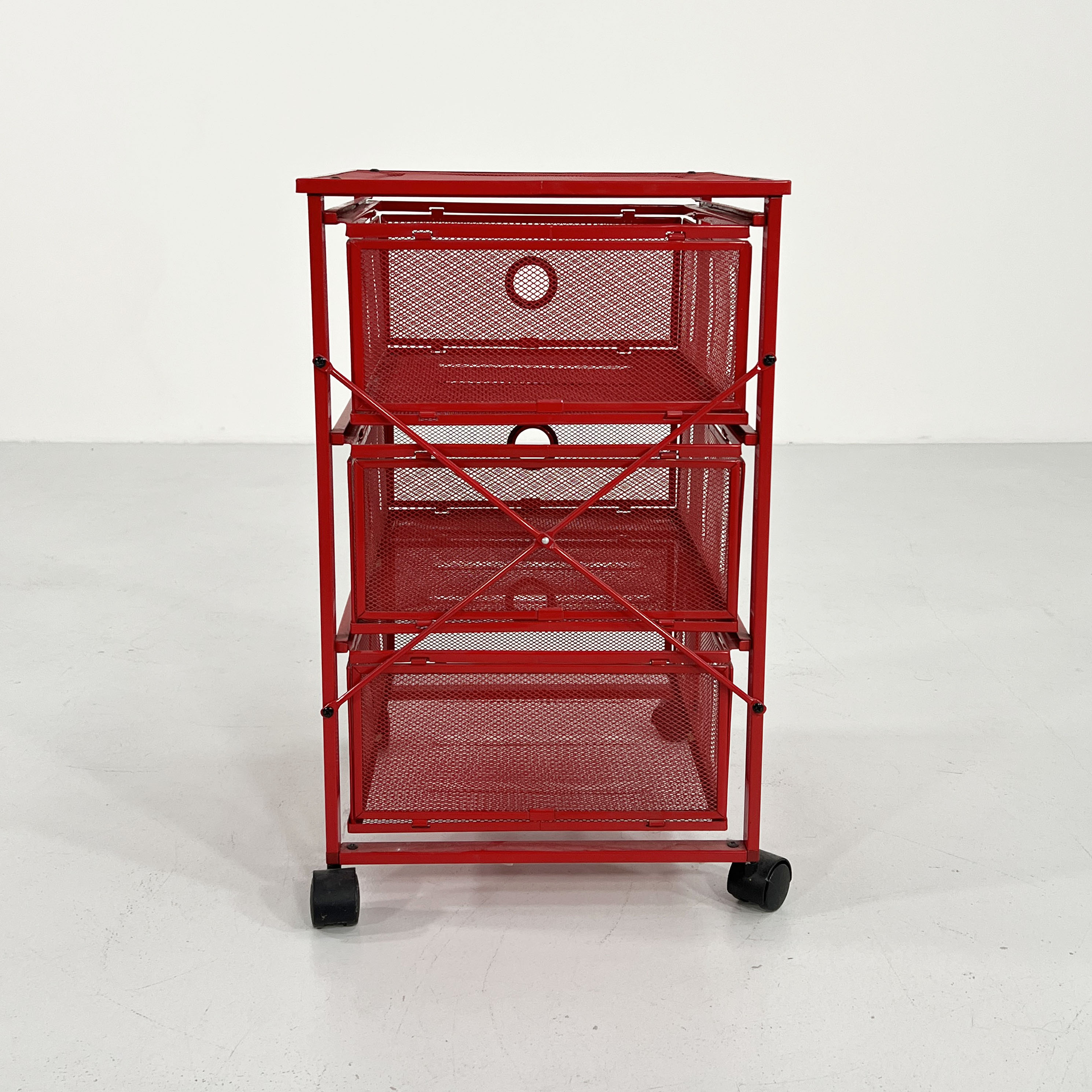 Chest of drawers on red metal wheels, 1980