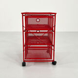 Chest of drawers on red metal wheels, 1980