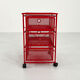 Chest of drawers on red metal wheels, 1980