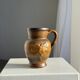 Speckled stoneware jug with grape pattern H17