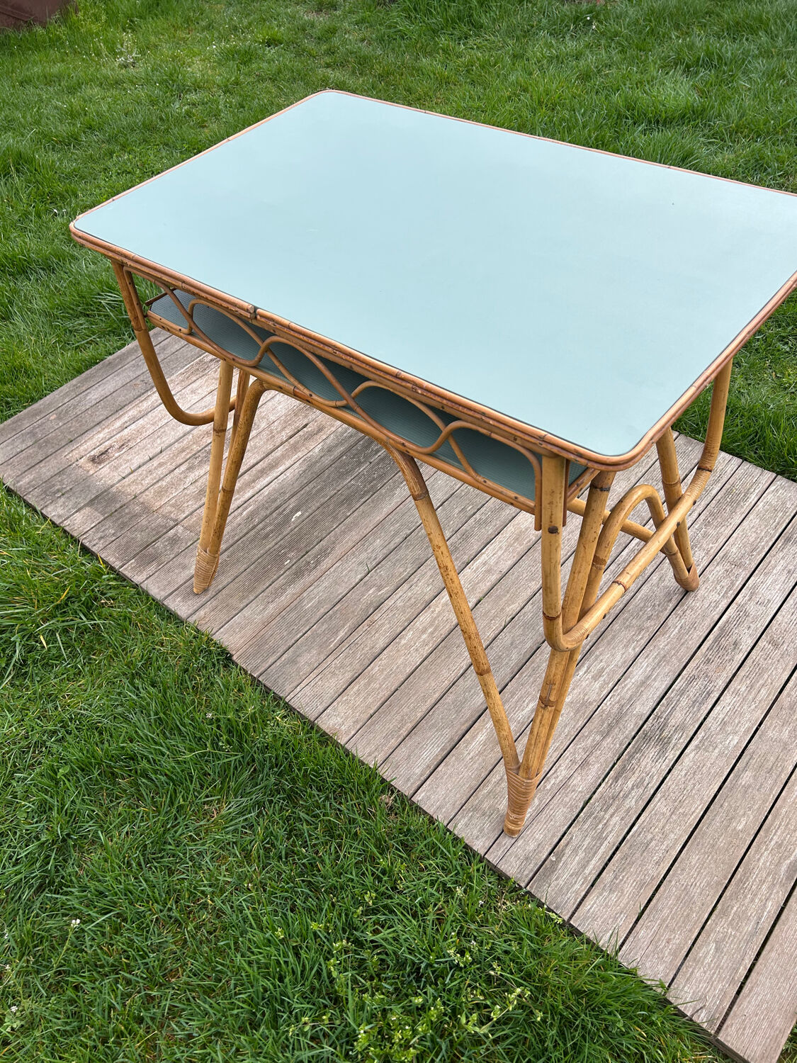 Small vintage rattan desk from the 1960s.