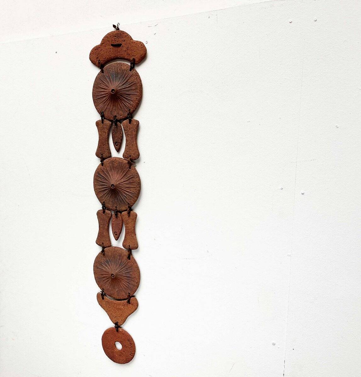Wall suspension of Danish studio pottery in mid-century brutalist modernist style by Clara Helmich, 1979.