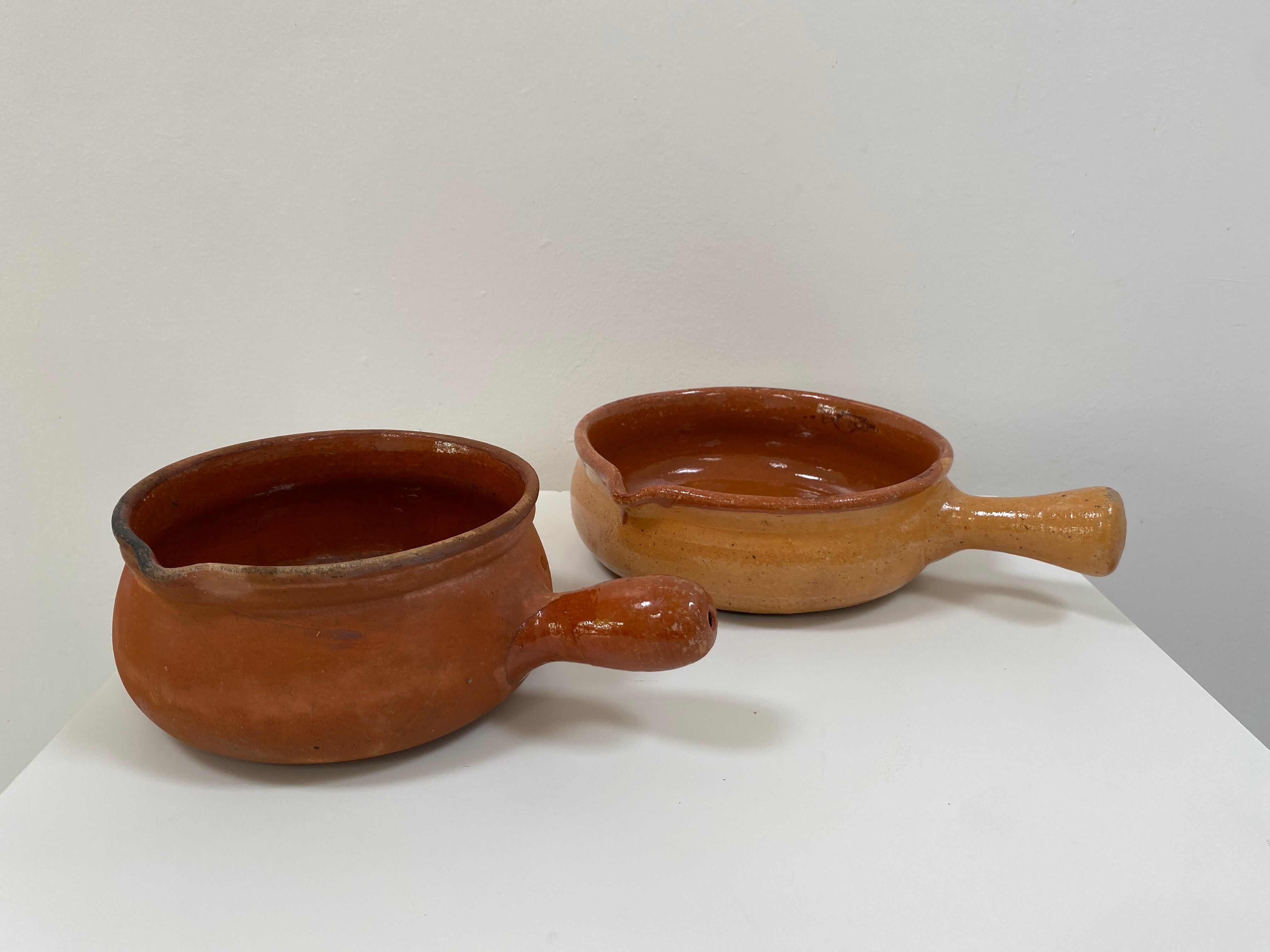 Pair of old pocket pots in glazed stoneware