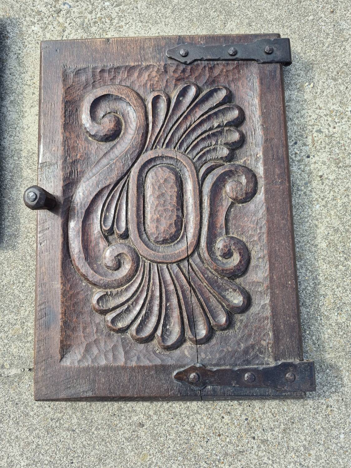 antique cabinet with carvings and wrought iron fittings rural