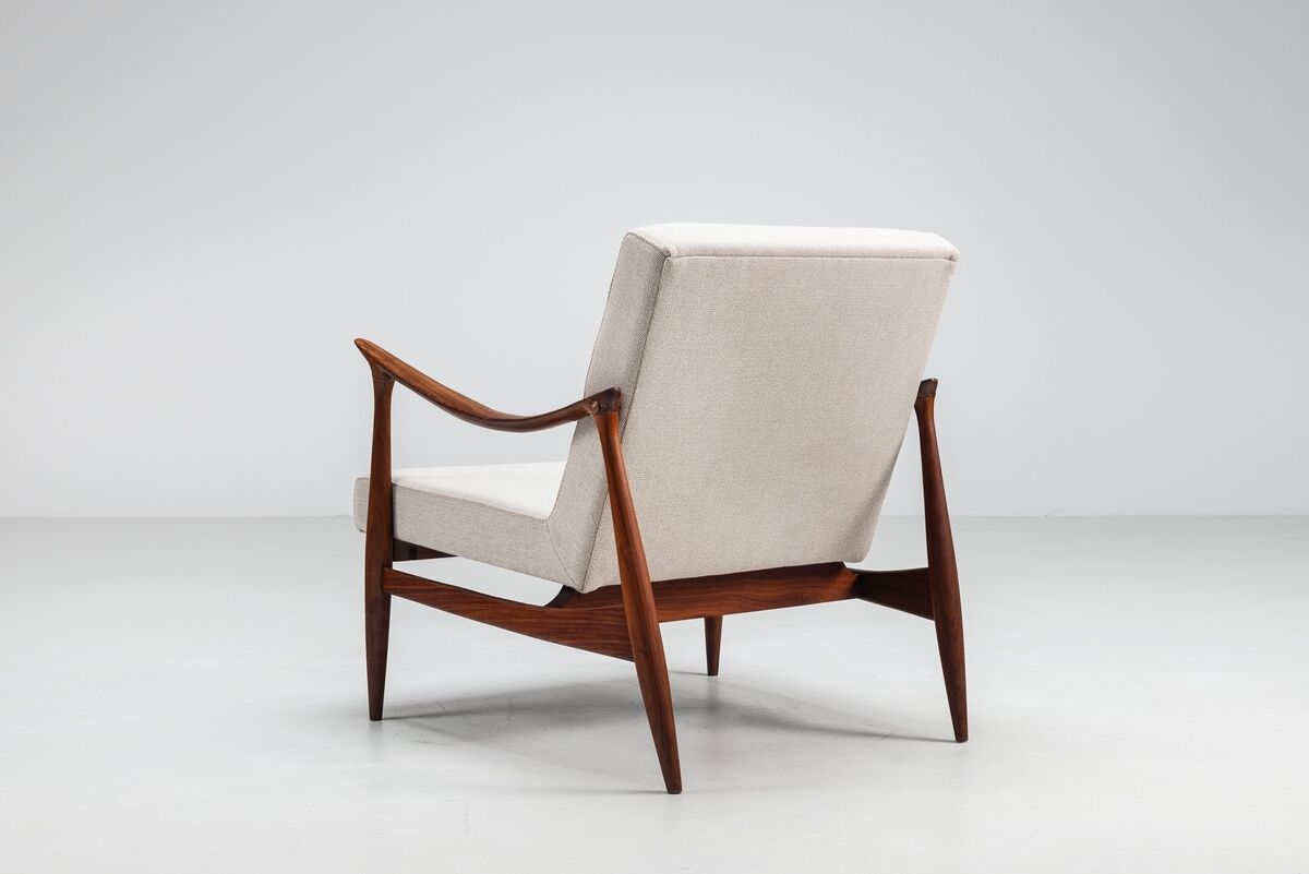 Sculptural Danish lounge chair in teak and fabric Denmark 1960
