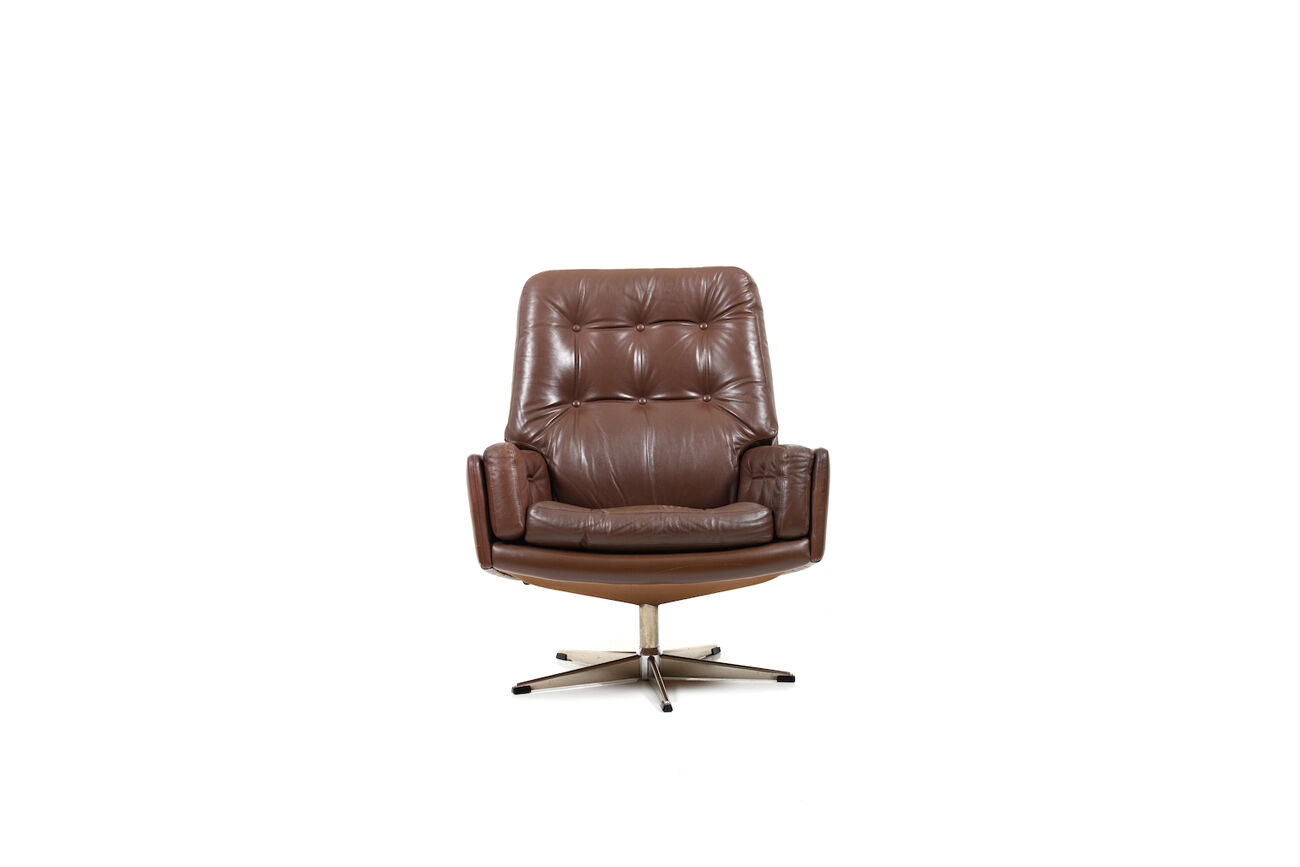 Danish swivel lounge chair in brown leather