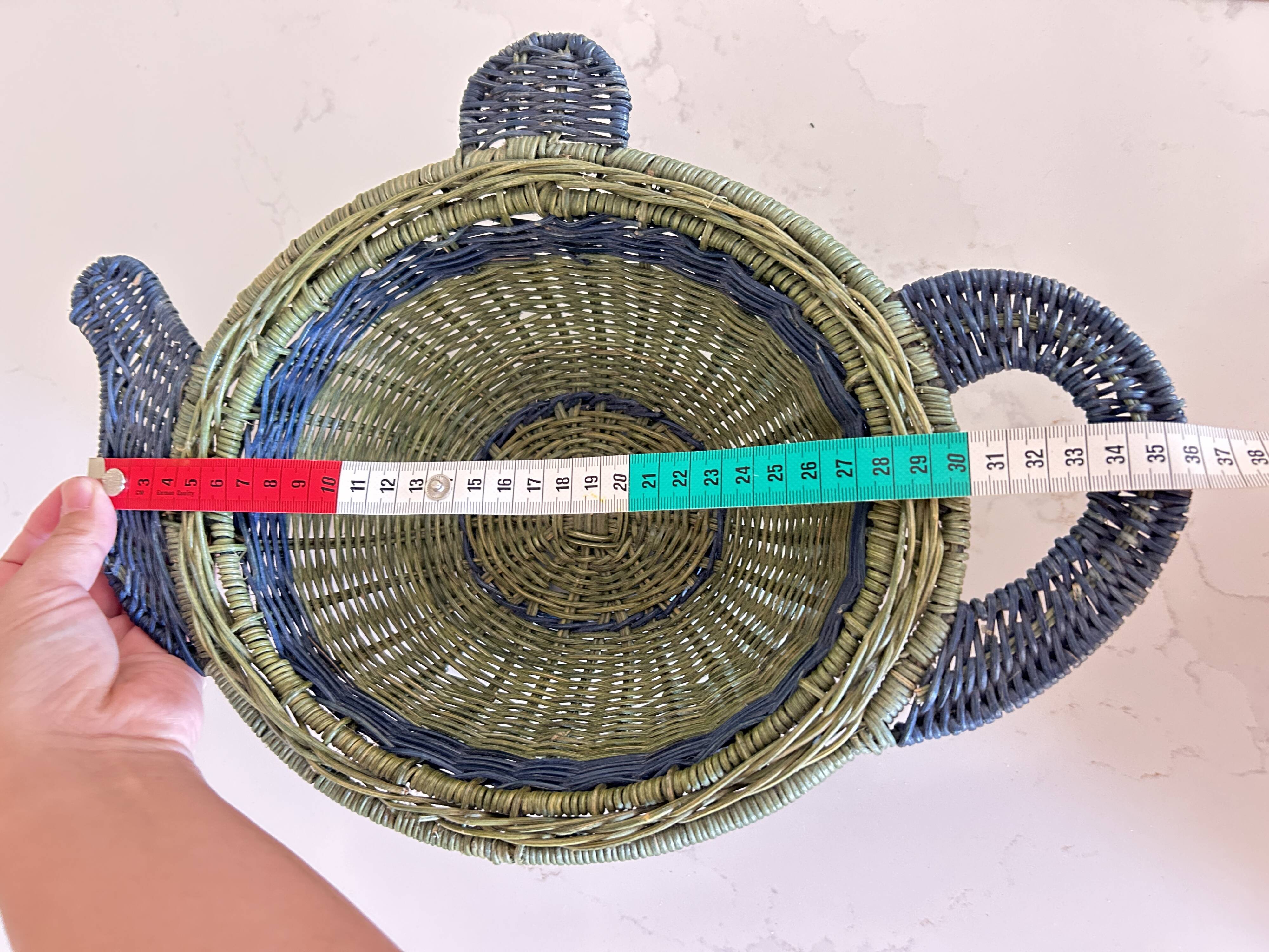 Rattan basket in the shape of a teapot.