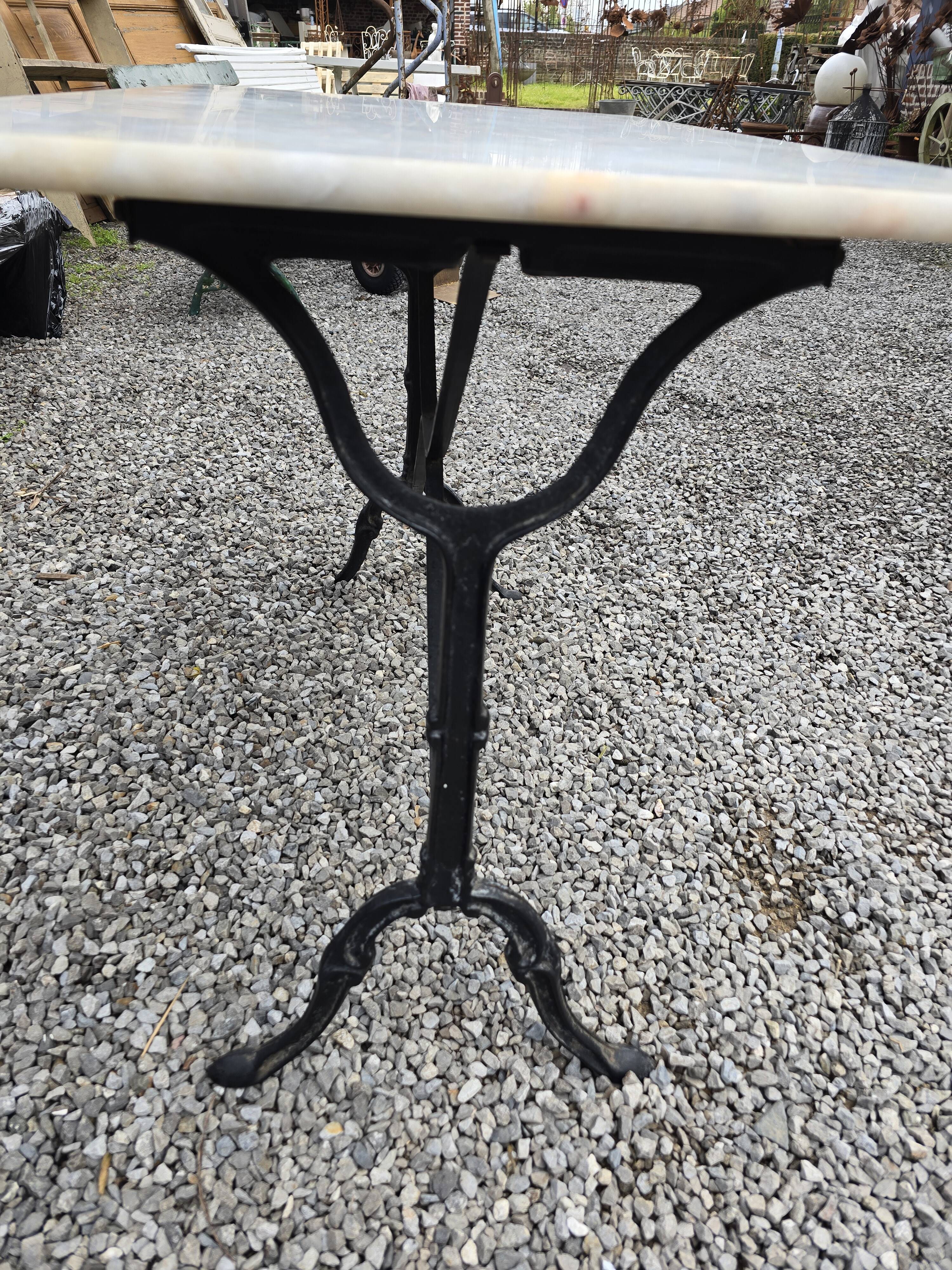 Bistro table with marble top and cast iron base