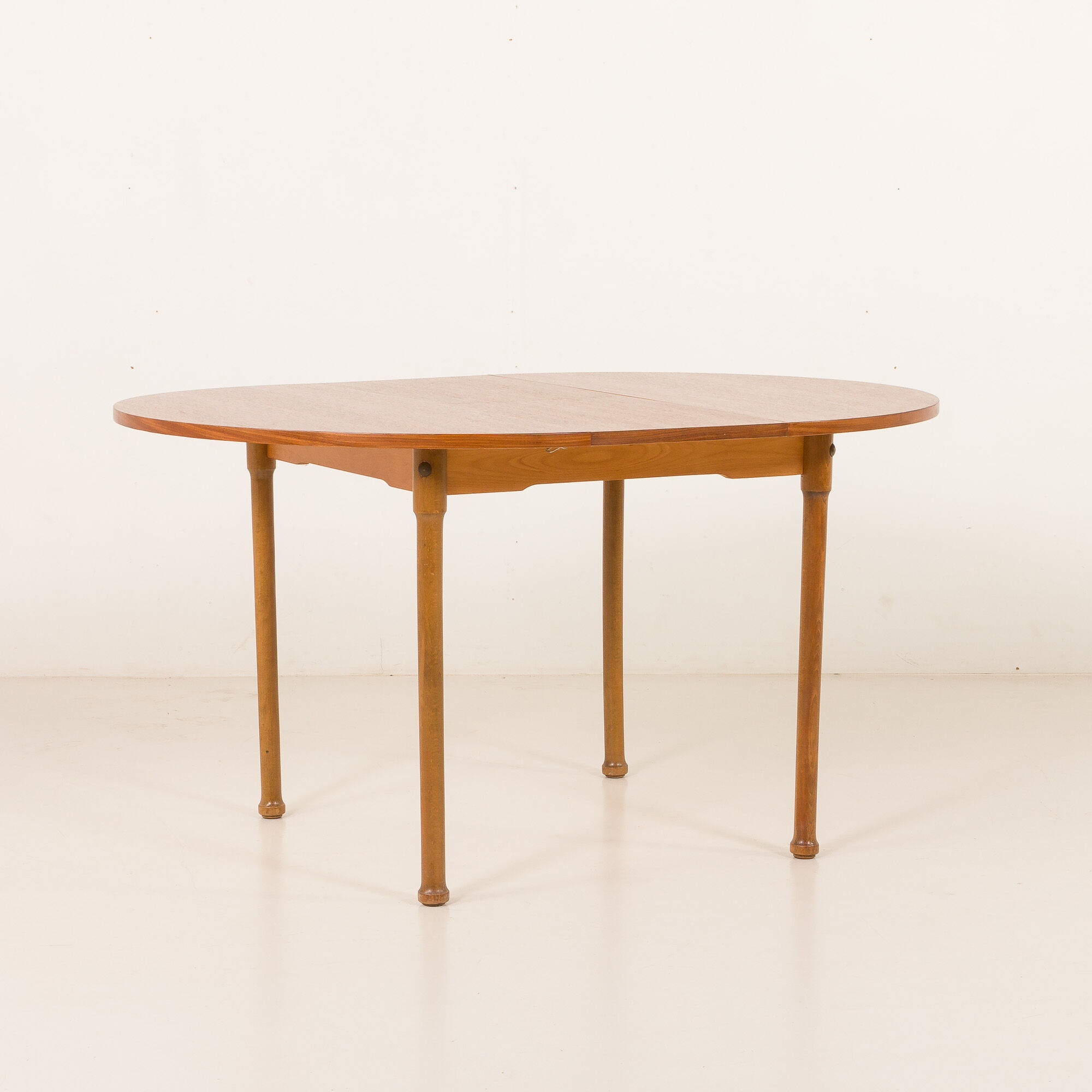 Teak round table with hidden extension, 1970s