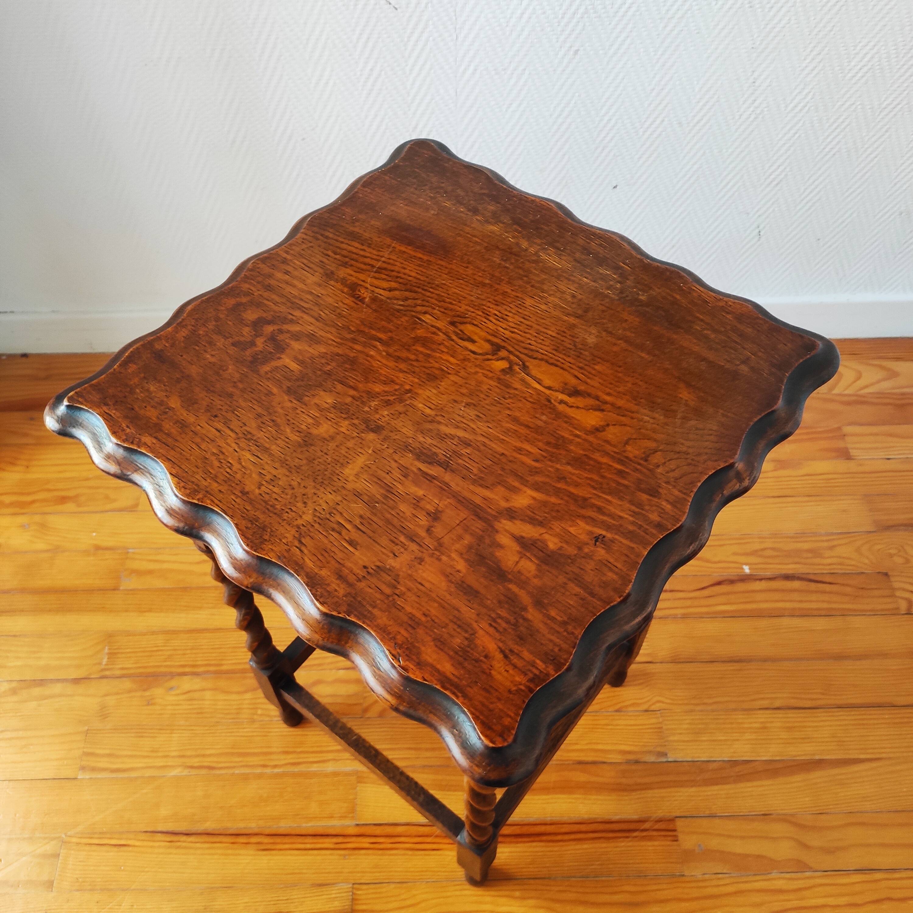 Antique solid oak side table with turned wooden legs.