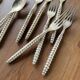 Set of silver-plated graphic cutlery for 6 people.