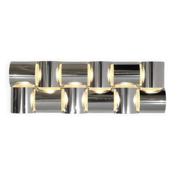 Contemporary wall light in stainless steel and metal.