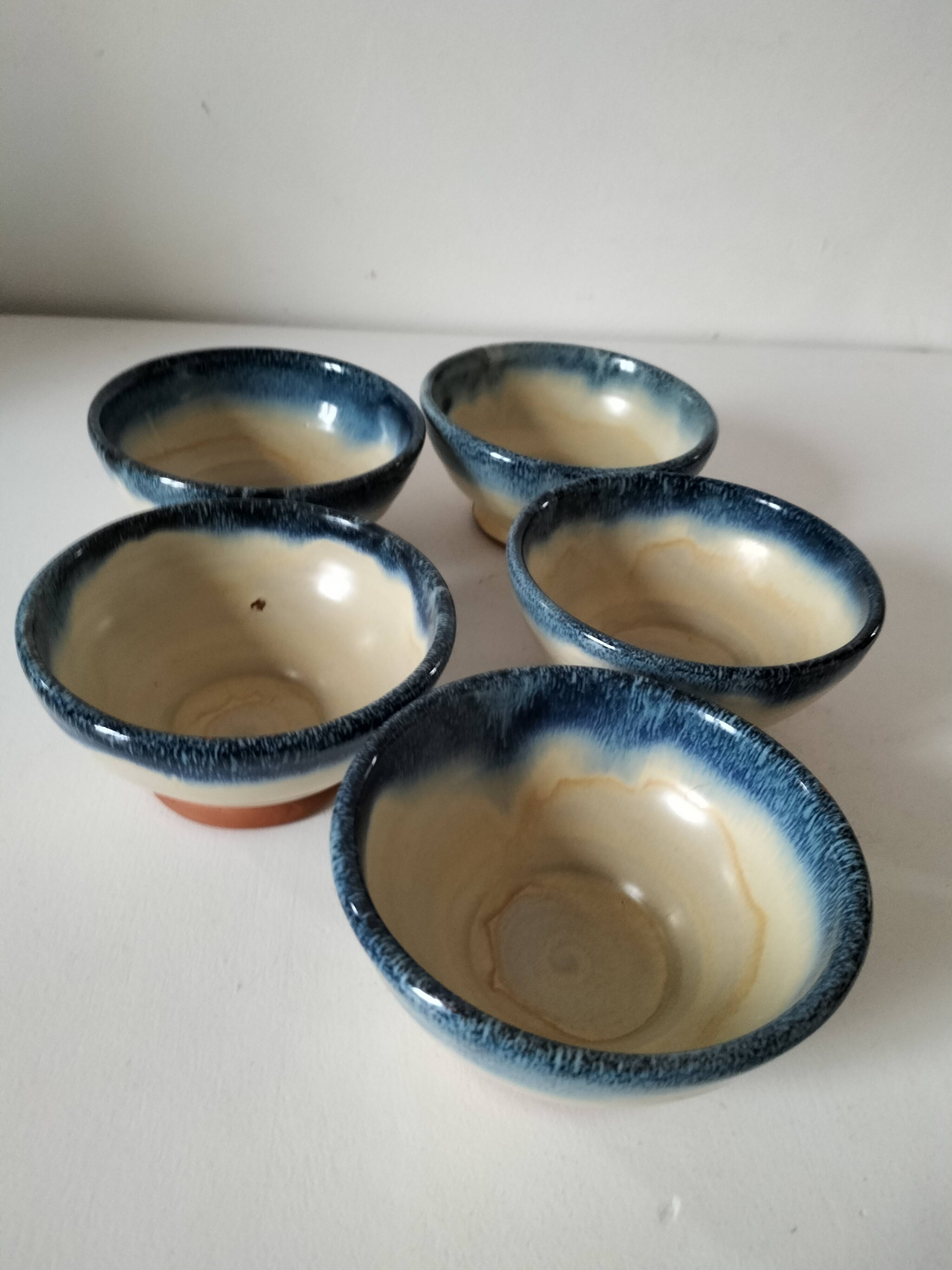 Set of 5 small blue and cream glazed stoneware bowls