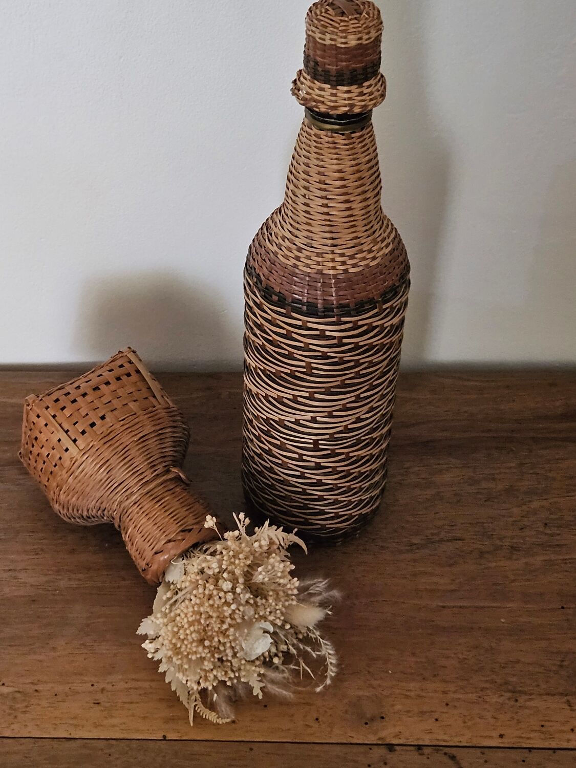 Glass and rattan bottle