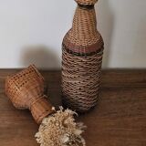 Glass and rattan bottle