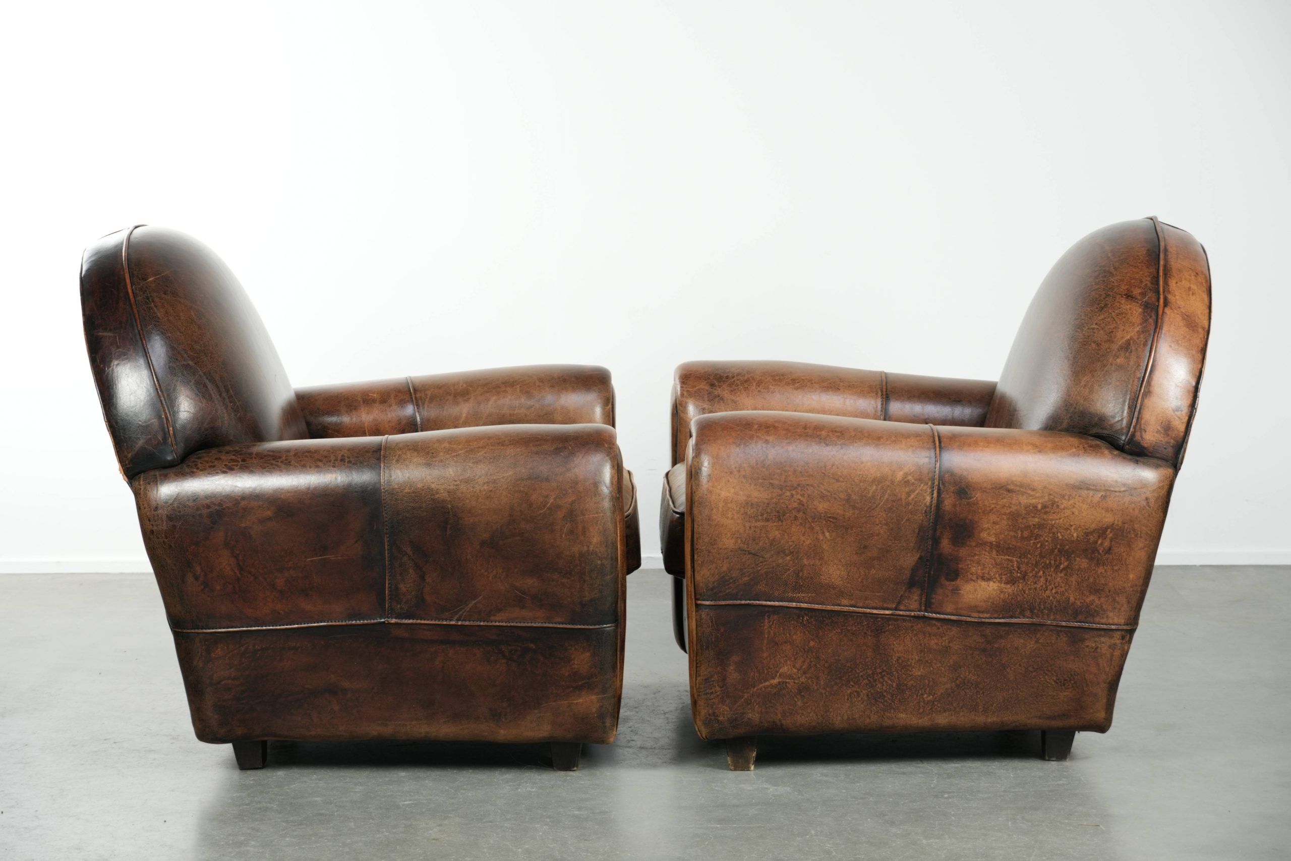 Set of two sheepskin Art Deco design armchairs with beautiful patina