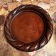 Pair of turned and carved wooden bottle coasters from the 1950s.