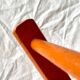 Vintage folding chair in orange painted wood