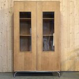 Glass-fronted school cabinet in raw oak