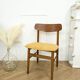 Scandinavian chair with mustard yellow fabric