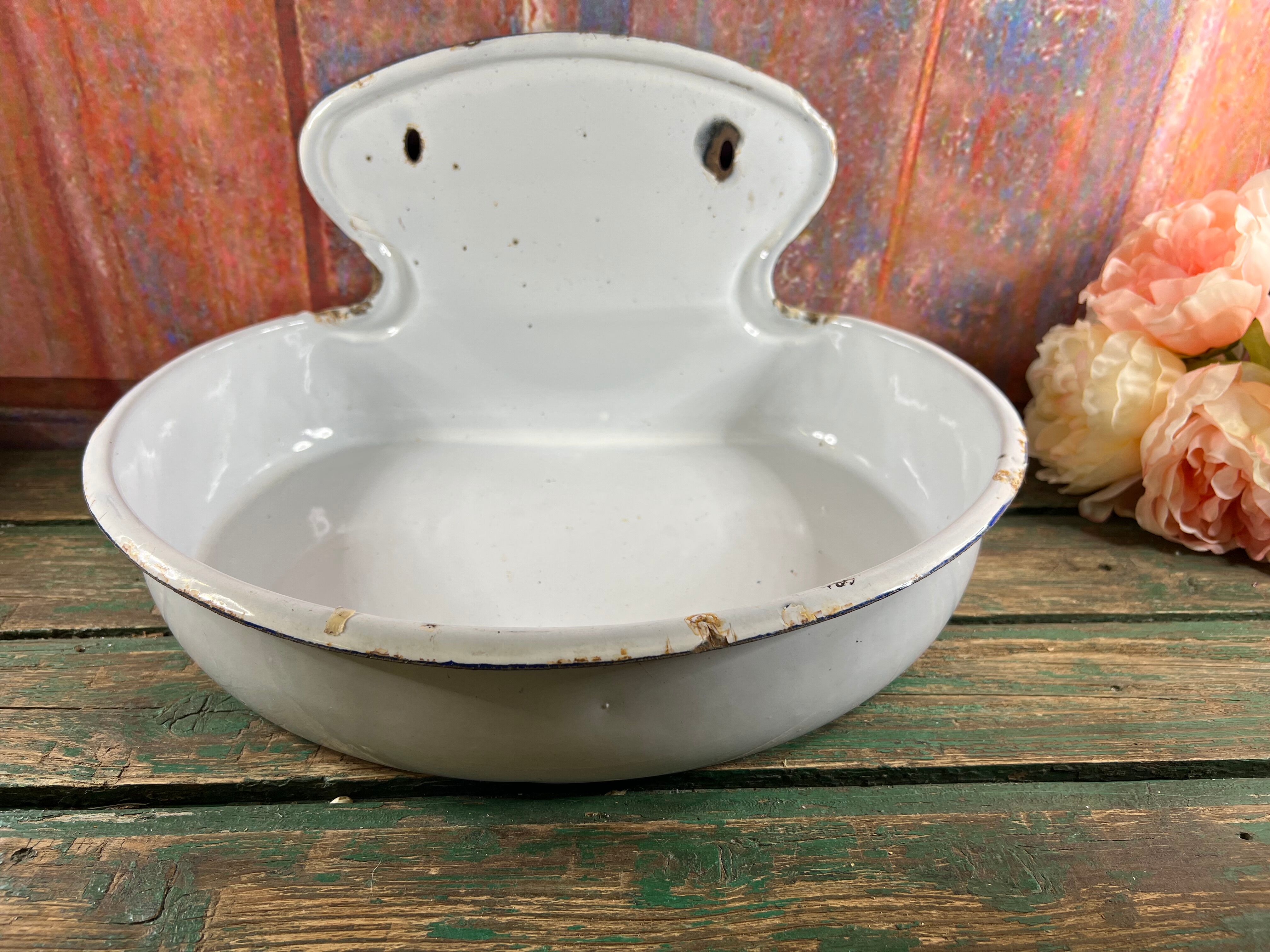 Old white enamelled hand washbasin or gardener enamel garden