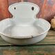 Old white enamelled hand washbasin or gardener enamel garden