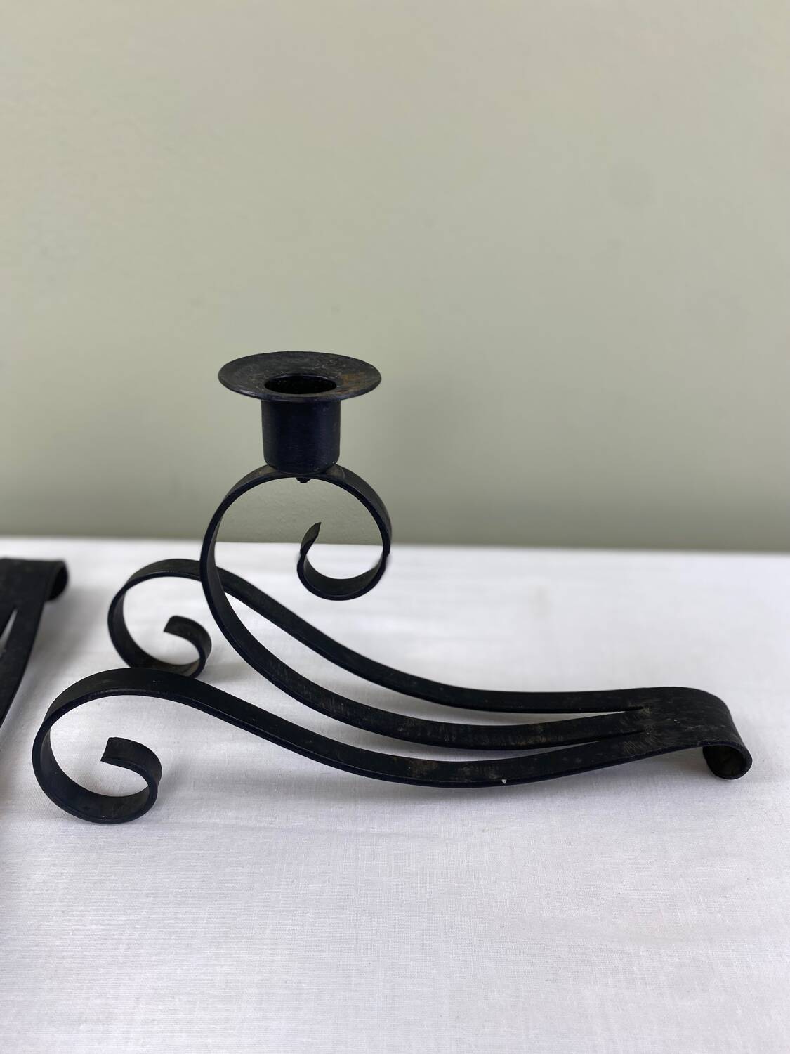 Pair of wrought iron candlesticks