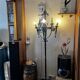 Medieval-style floor lamp, made of wrought iron.