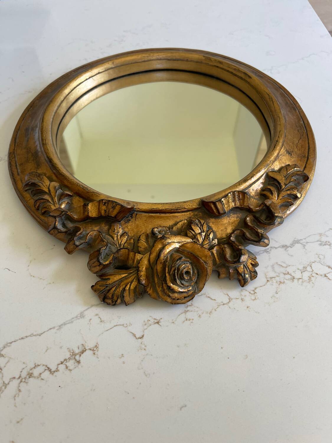 Round carved wooden mirror