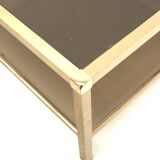 Large vintage Hollywood Regency coffee table made of brass and smoked glass from the 1970s