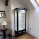 Antique display cabinet repainted in black.