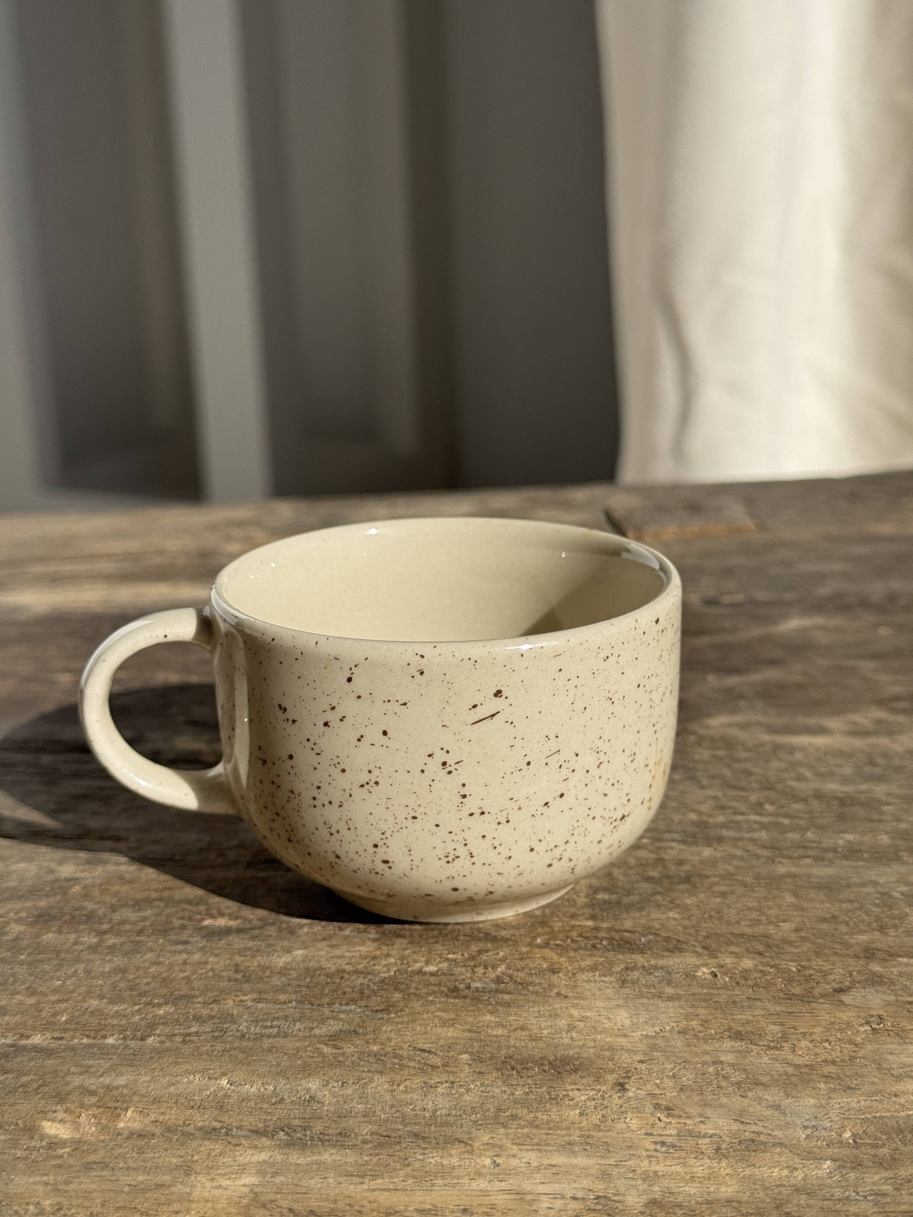 Set of 4 vintage speckled beige stoneware coffee cups.