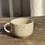 Set of 4 vintage speckled beige stoneware coffee cups.