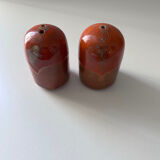 Salt and pepper shakers in orange stoneware