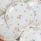 Set of 9 flat plates in Limoges porcelain, white and gold